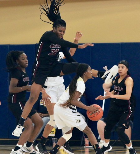 Sierra College's Kiki Griffi leaps to block a shot.